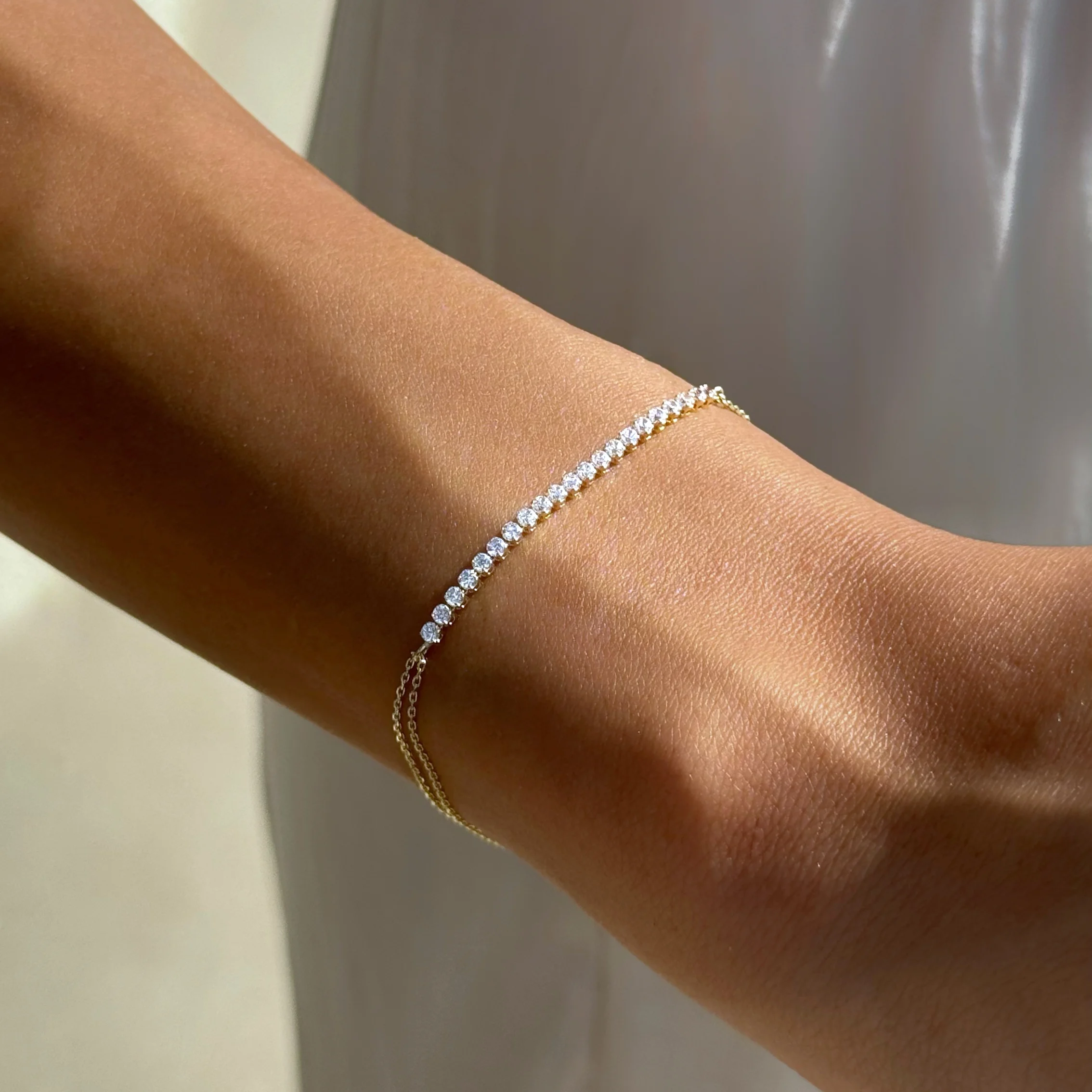 Tennis Kettenarmband aus 585er Gold mit funkelnden Zirkonia – luxuriöse Eleganz für stilvolle Looks.